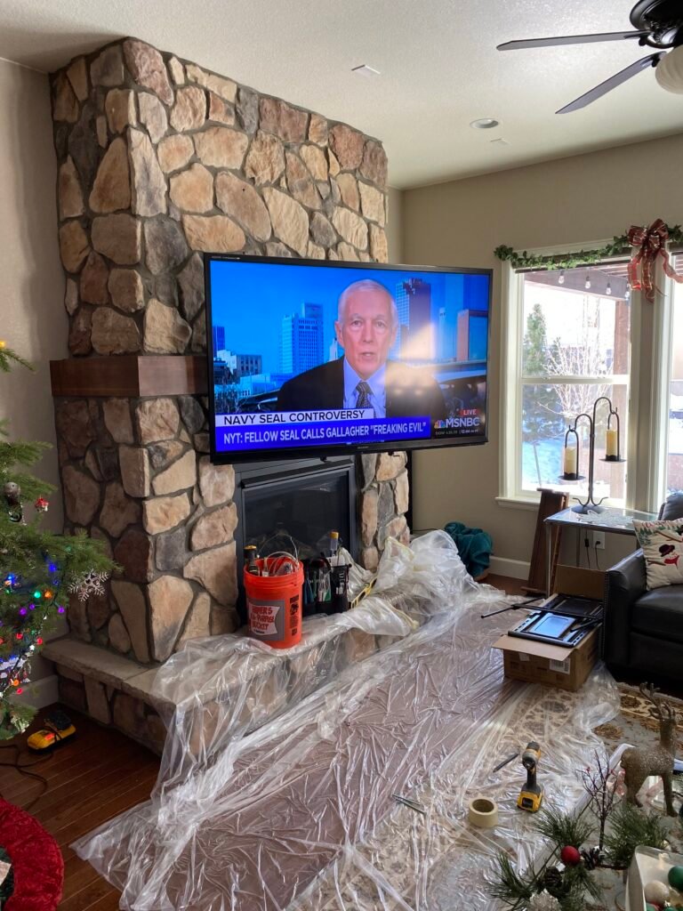 TVWallMountAboveStoneFireplace